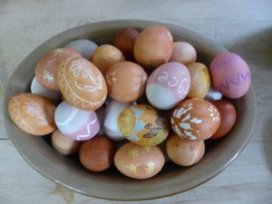 A bowl of decorated Easter eggs