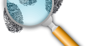 An illustration of a magnifying glass and fingerprints