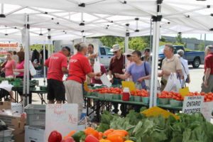 People shopping at the farmers' market.