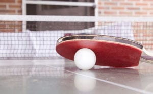 Ping pong paddle and ball.