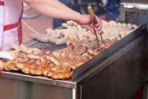 Sausages grilling on a BBQ.