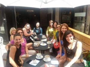 A group of women sitting having coffee.
