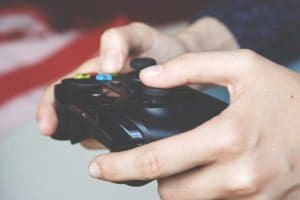 Hands using an xbox controller.