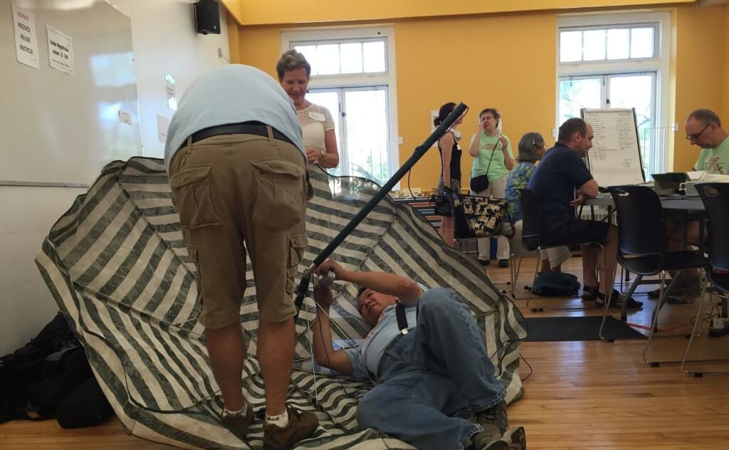 People repairing an umbrella.