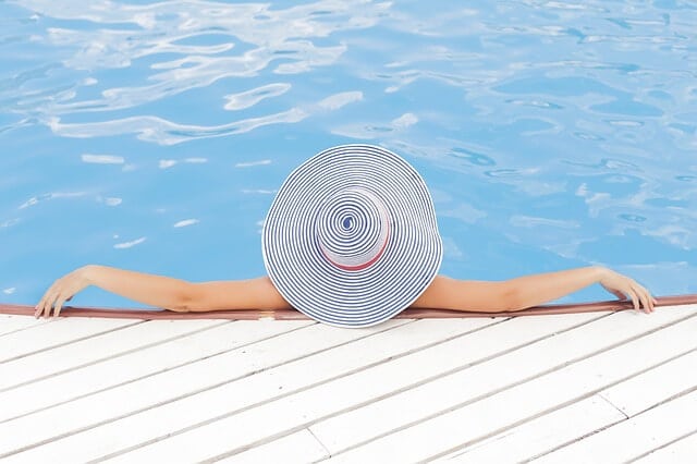 A woman relaxing in a pool.