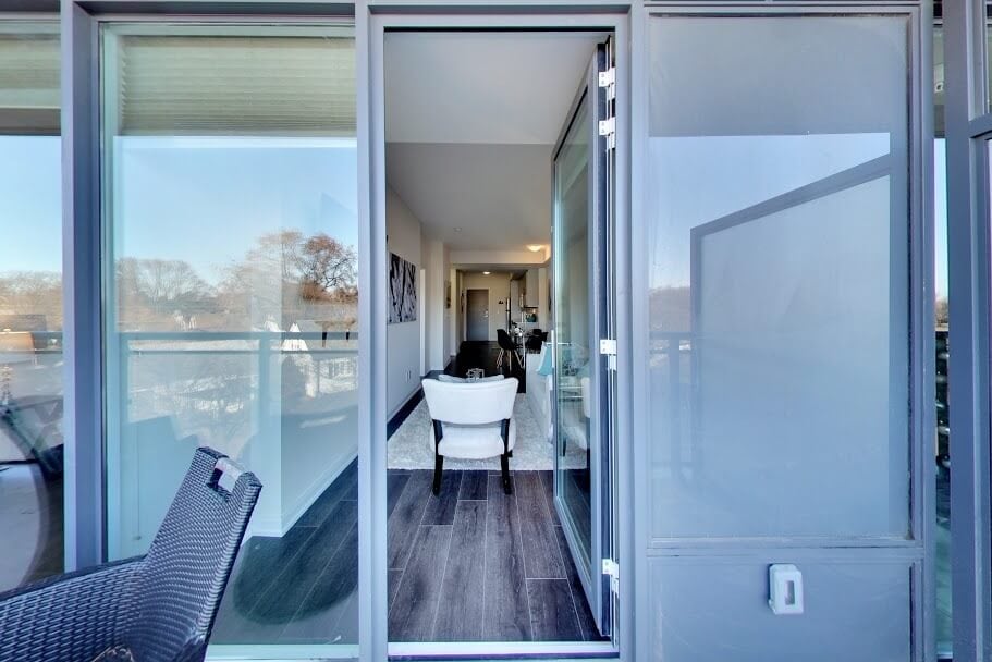 A condo through a balcony door.