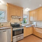 kitchen with granite counters and stainless steel appliances at 10 woodbury place