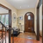 Wood trim and lovely arched front door at 1370 Islington Avenue