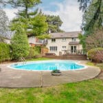 Depiction of pool and deep back yard as well a rear facade at 1370 Islington Avenue