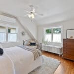 Second bedroom with rich hardwood floors overlooking backyard at 1370 Islington Avenue