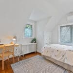 Third bedroom with hardwood floors and built-in shelves at 1370 Islington Avenue
