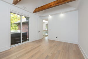 Versatile second-floor office or den with vaulted ceilings and access to the upper terrace at 28 Martin Grove Road.