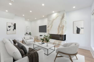 Living room with pot lights and three sided fireplace at 28 Martin Grove Road Etobicoke home for sale