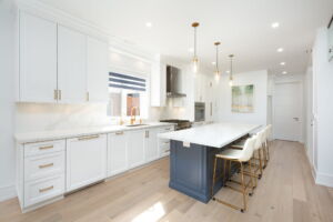 Custom chef's kitchen at 28 Martin Grove Road featuring premium Thermador appliances, quartz countertops and an oversized centre island.