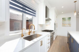 Premium Thermador gas range, integrated appliances and custom cabinetry in the chef's kitchen at 28 Martin Grove Road
