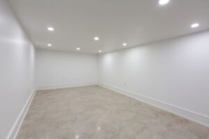 Bright basement flex room with nine-foot ceilings and radiant-heated concrete flooring at 28 Martin Grove Road
