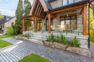 Contemporary front entrance with natural stone accents at28 Martin Grove Road