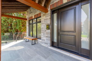 Covered front porch with exposed timber beams at28 Martin Grove Road in Etobicoke